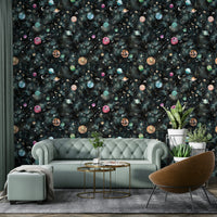 Wallpaper with cosmic scenes of swirling galaxies and bright stars against a blue sky.

