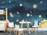Kids room with a space joy dark wall mural on canvas material featuring a white table and cute bunny-eared chairs.