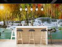 Natural Sparkling Waterfall Jungle wallpaper mural styled along a hallway feature wall near a console in blue tones