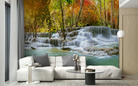 Natural Sparkling Waterfall Jungle wallpaper mural as a feature wall in a home office workspace in blue tones