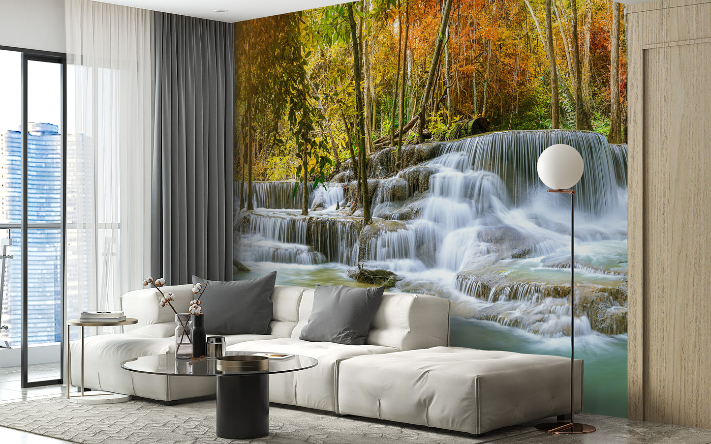Natural Sparkling Waterfall Jungle wallpaper mural styled as a feature wall behind a dining table and chairs in blue tones
