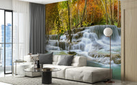 Natural Sparkling Waterfall Jungle wallpaper mural styled as a feature wall behind a dining table and chairs in blue tones