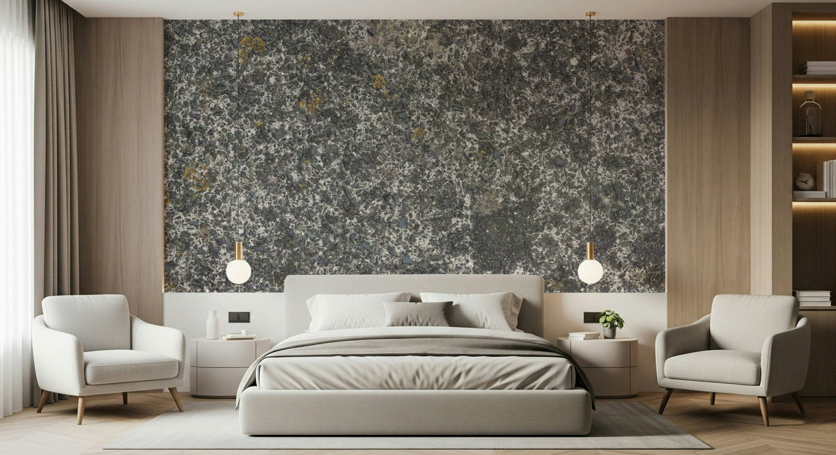 Speckled Stone Texture wallpaper mural above a grey bed flanked by two white armchairs and globe pendants