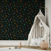 The design includes various festive motifs like planets, stars, and candy.
