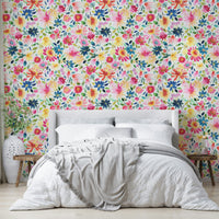 Wallpaper with zinnias in full bloom, surrounded by soft green foliage.

