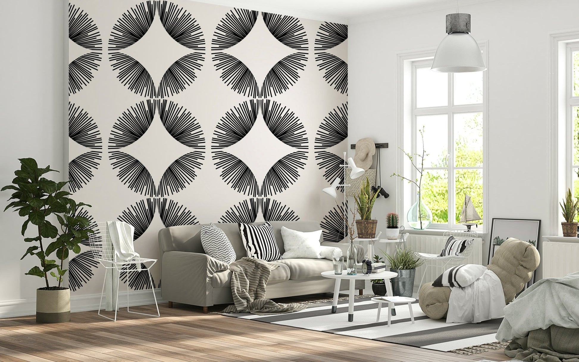 Starburst Deco wallpaper of black starbursts on cream behind a grey sofa with striped cushions and beanbag
