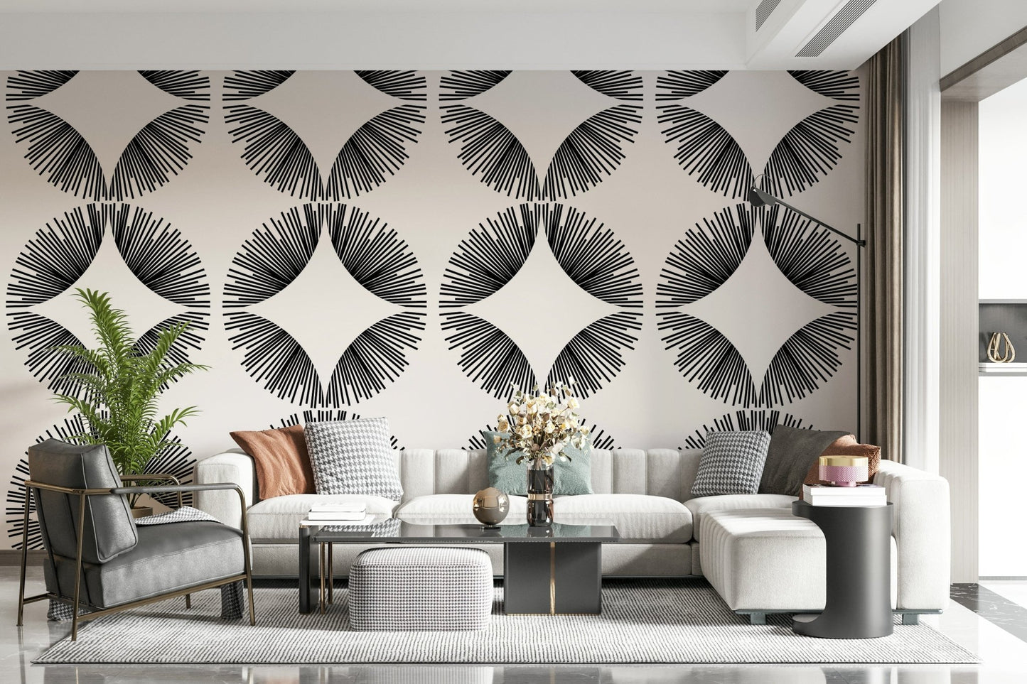 Starburst Deco wallpaper of black starbursts on cream behind a cream sectional with houndstooth cushions
