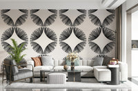 Starburst Deco wallpaper of black starbursts on cream behind a cream sectional with houndstooth cushions