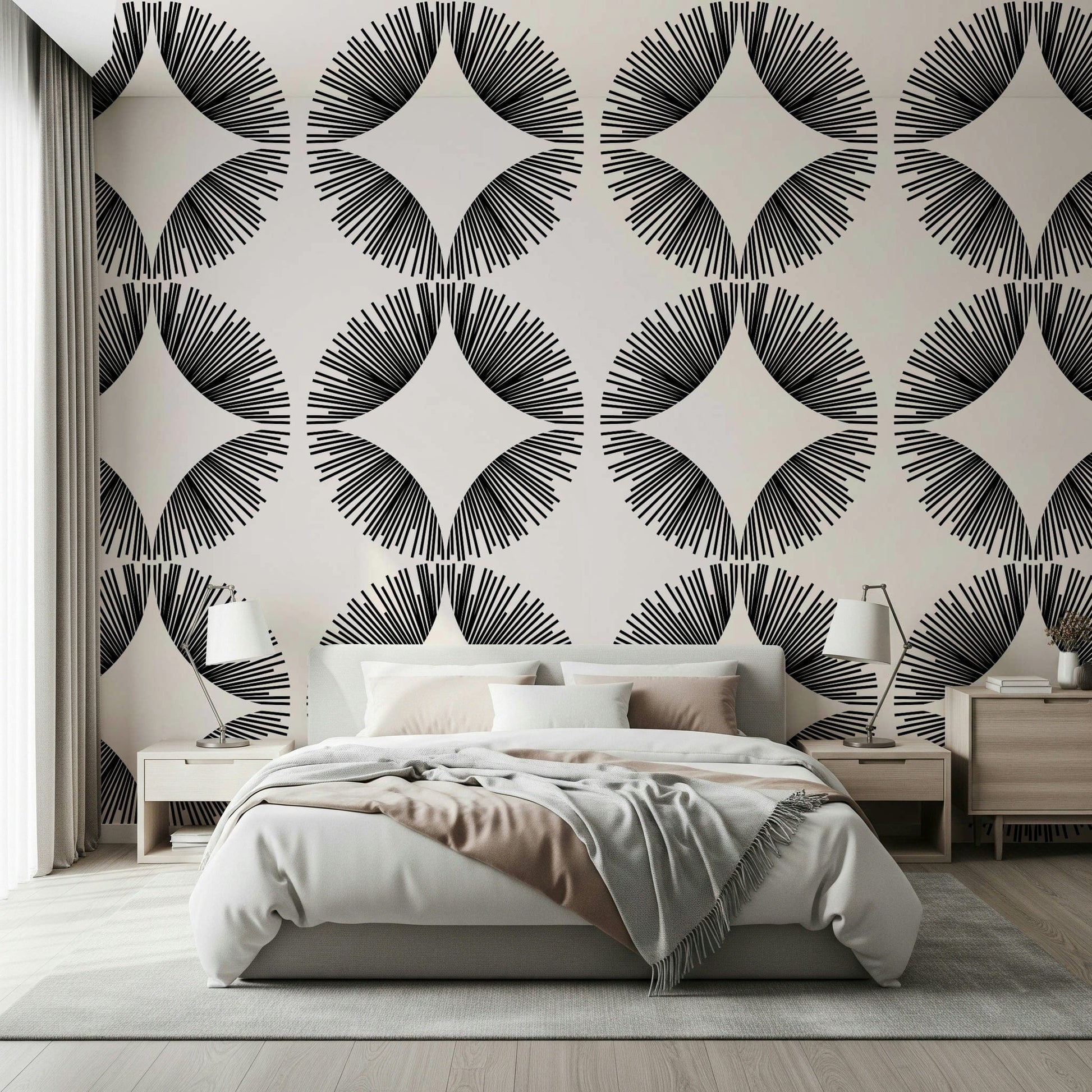 Starburst Deco wallpaper of black starbursts on cream behind a bed with blush bedding and wood nightstands
