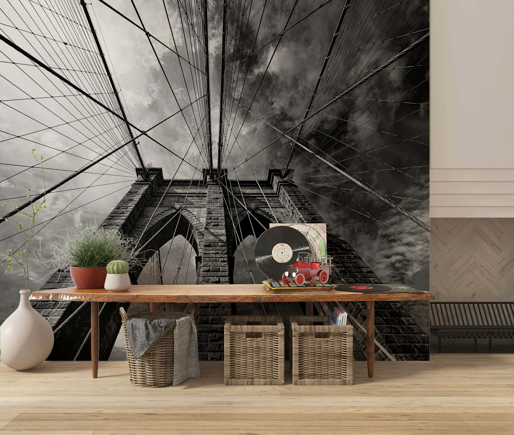 Suspended in Stone wallpaper mural of the black-and-white Brooklyn Bridge tower above a wood console in an entryway