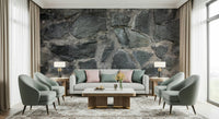 Stone Facade wallpaper mural behind a grey sofa with pink pillows flanked by two sage armchairs