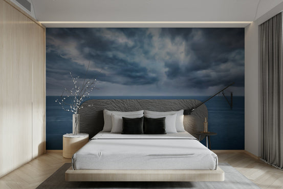 Moody Ocean Vista wallpaper mural of a stormy sea behind a low wood platform bed with white bedding