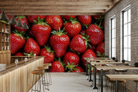 The design shows ripe red strawberries with green leaves and white flowers.
