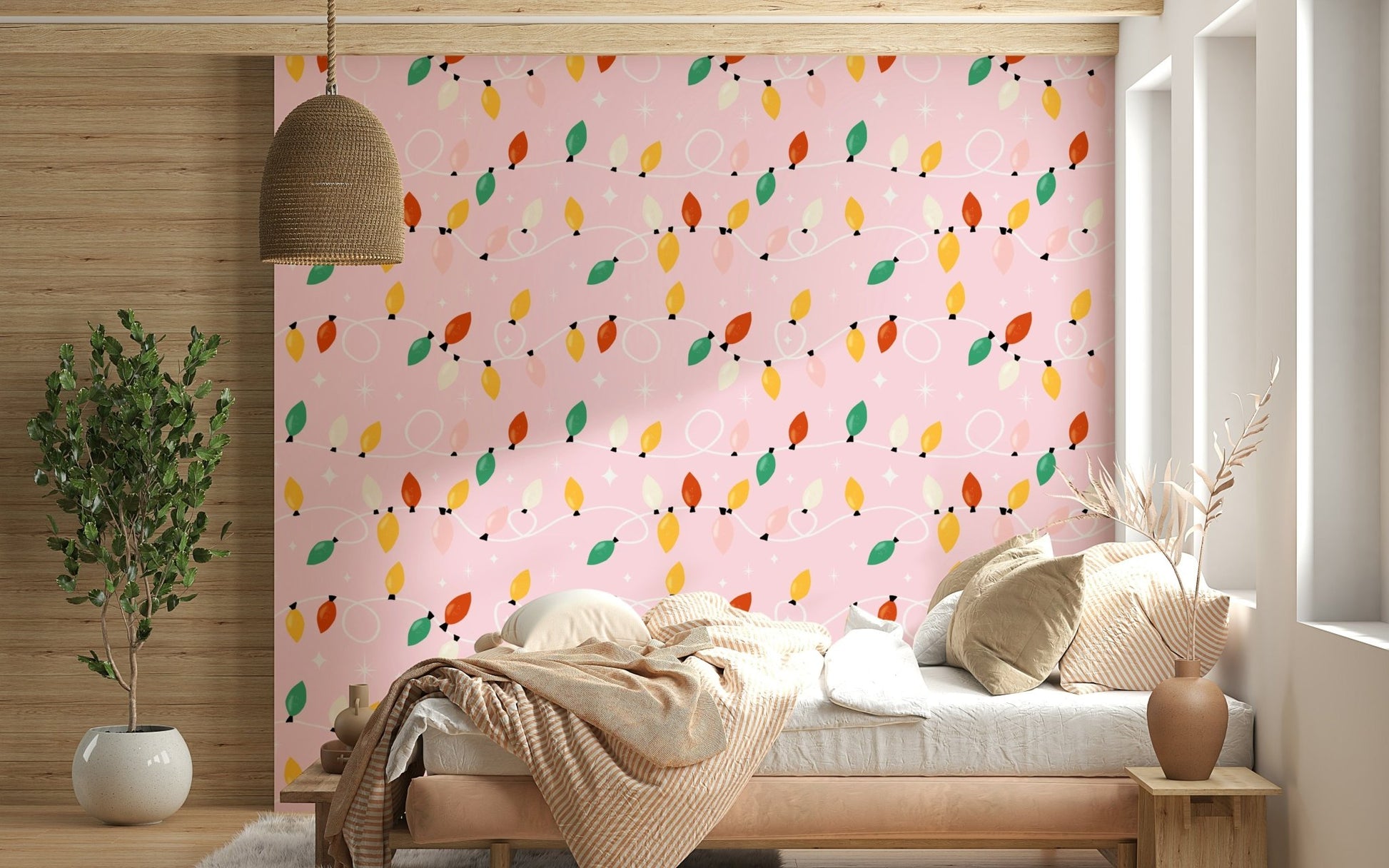 Playful string lights in red, yellow, green, and cream looping across a soft pink wallpaper.