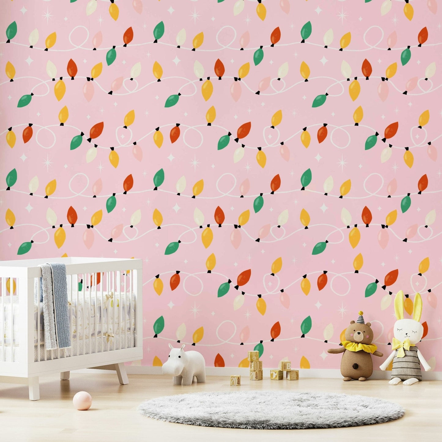 Pink wallpaper showcasing looping holiday lights in warm, vibrant colors with star details.