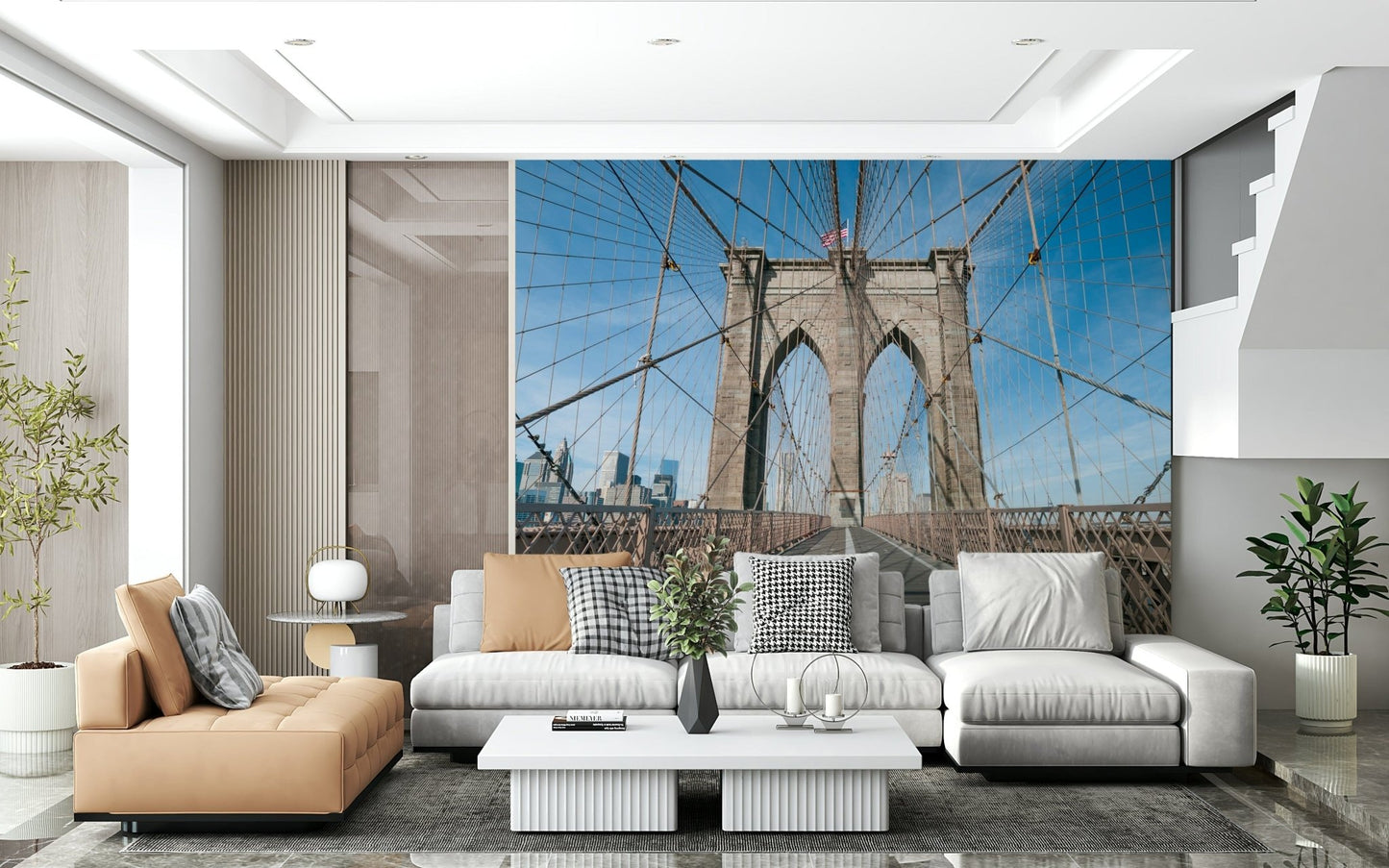 Strolling Across the Brooklyn Bridge wallpaper mural in a living room with a tan leather chaise and white sectional