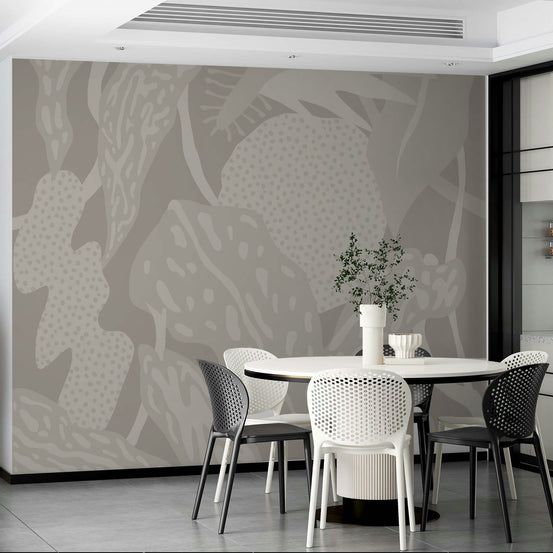 Subtle Foliage Reverie wallpaper mural with tonal greige leaves and dotted shapes in a dining room with round white table