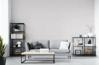 Minimalist art deco wall decor featuring a repeating cream shell pattern in a bedroom.