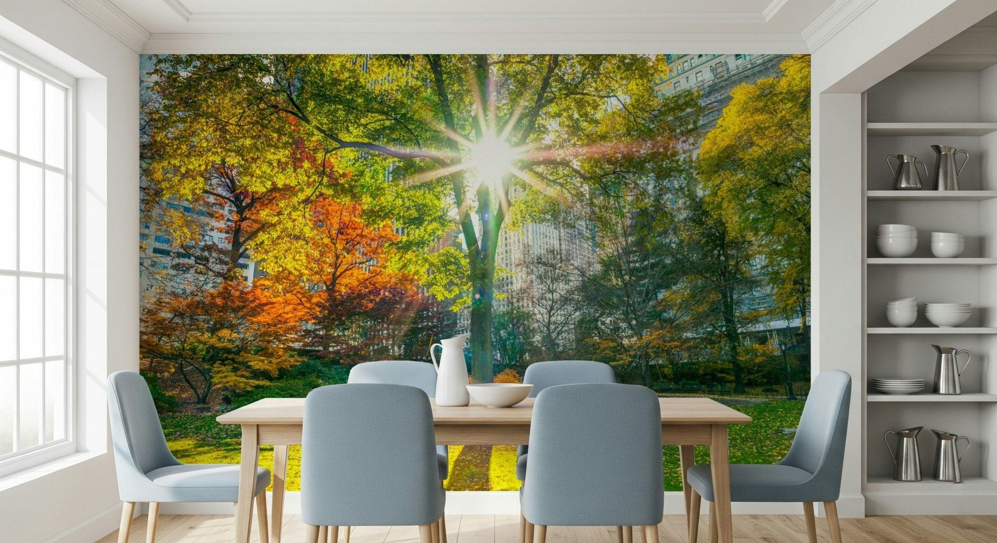 Sun Rays Through Trees wallpaper mural of a sunlit autumn park in a dining room with wood table and blue-grey chairs