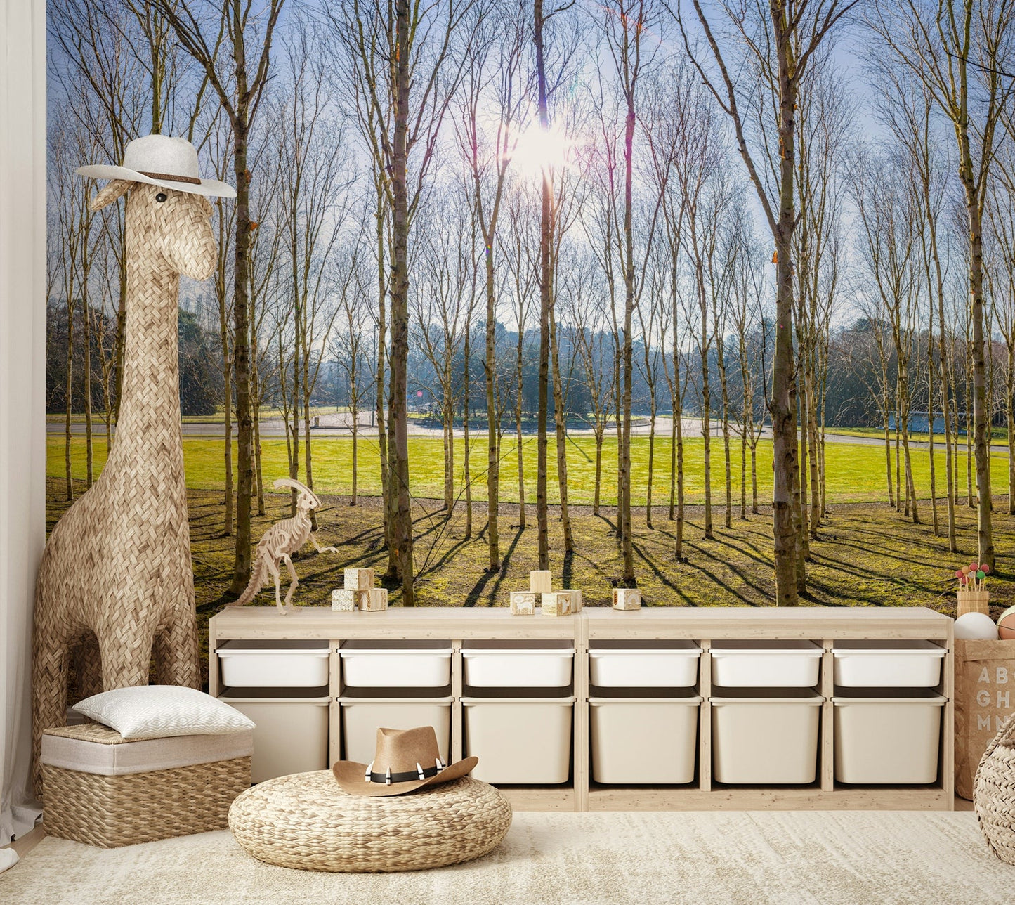 A wall mural of a sunlit woodland scene.

