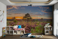 The mural is installed in a calm living room behind a simple, light-colored sofa.

