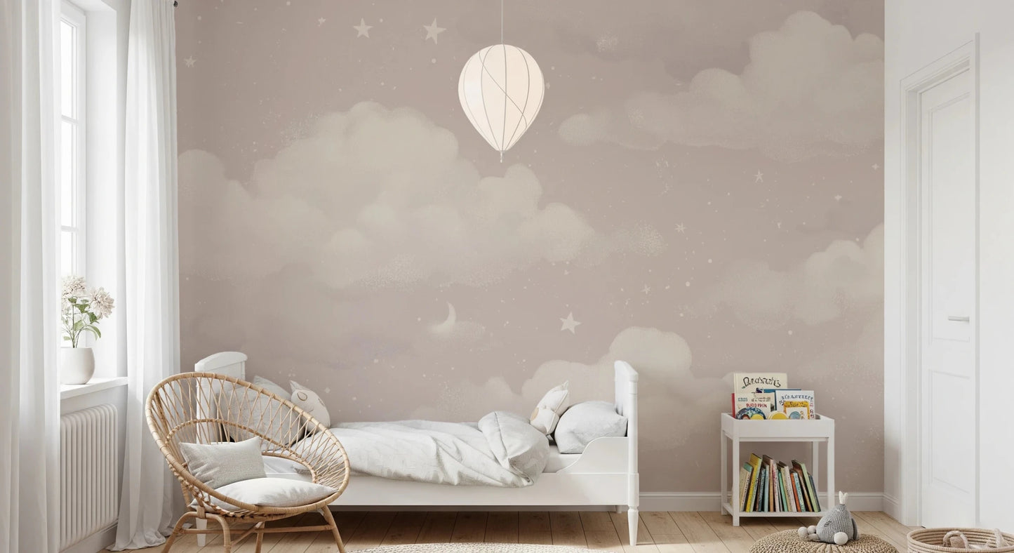Sweet Dreams Blush wallpaper mural of a blush cloud sky in a kids bedroom with a white bed and rattan chair