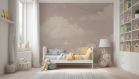 Sweet Dreams Blush wallpaper mural of pink clouds in a kids bedroom with a white bed and yellow throw by the window