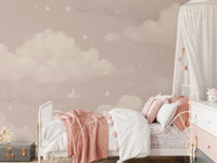 Sweet Dreams Blush wallpaper mural of a blush cloud sky in a girls bedroom with a white bed and pink pom-pom throw