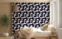Sweet cartoon stars and clouds floating across a deep blue background create a gentle night wallpaper.
