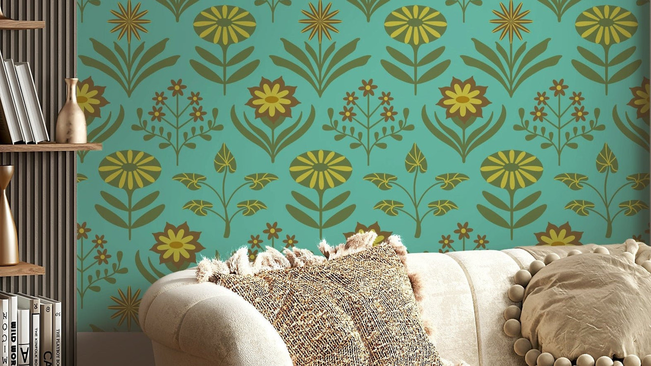 Stylized floral and leaf patterns in olive green, brown, and turquoise on a wall.

