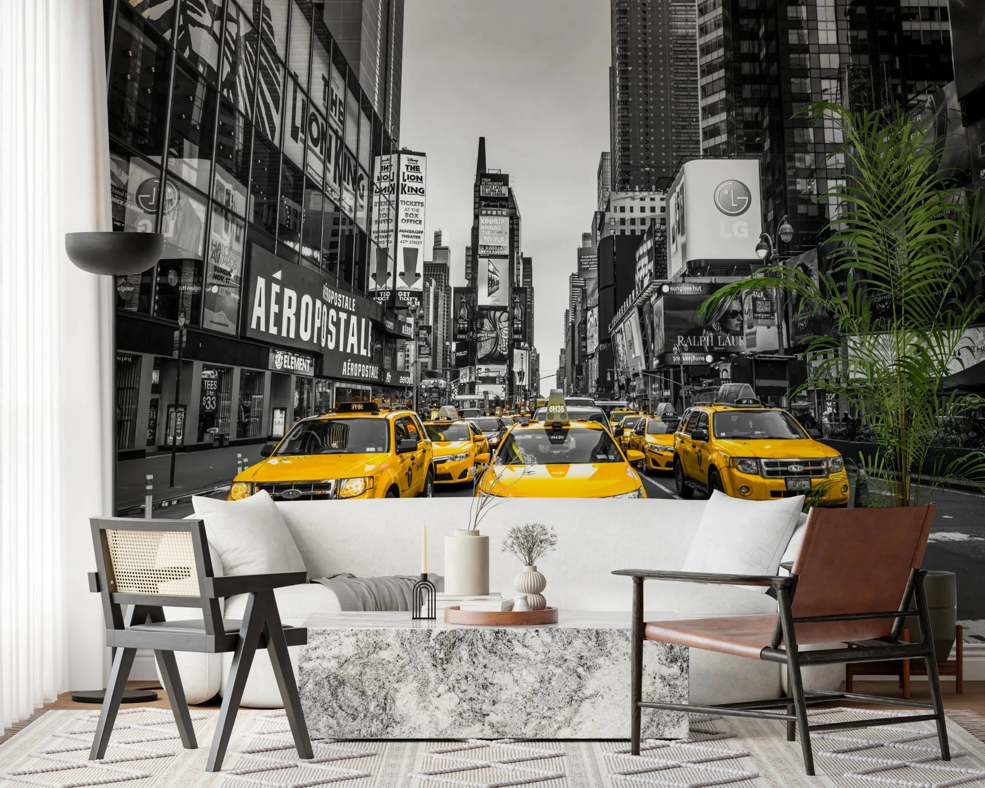 Taxi Rush Hour wallpaper mural showing yellow taxis in New York behind a white sofa and cane chair in a living room