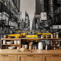 Taxi Rush Hour wallpaper mural of yellow cabs in Times Square above a wood kitchen counter with kettle and dishes