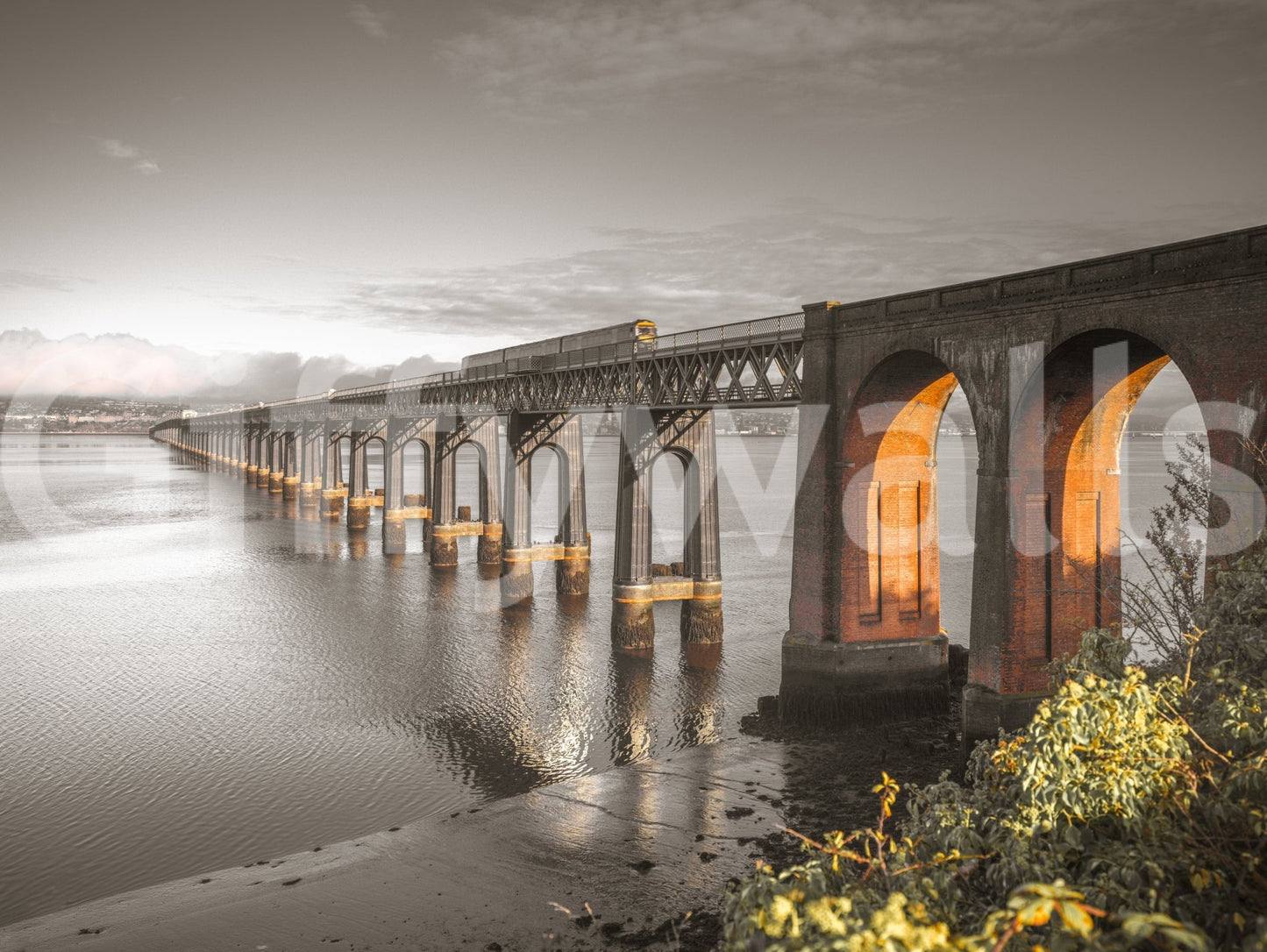Tay Rail Bridge shown as a full-wall mural, sepia photo of the bridge with brick arches glowing orange over water