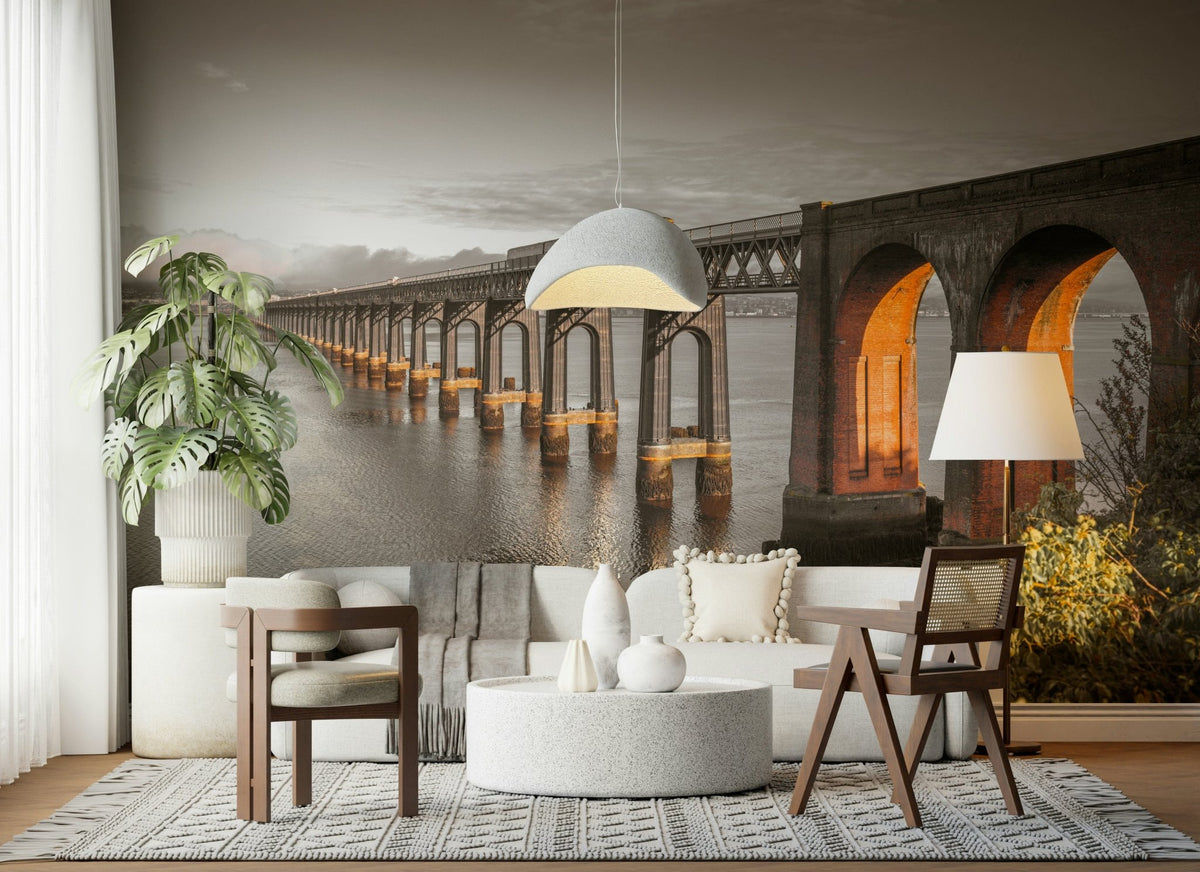 Tay Rail Bridge wallpaper mural in sepia tones behind a white sofa and cane chairs in a living room