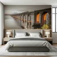 Tay Rail Bridge wallpaper mural with glowing arches above a grey bed with white bedding in a bedroom
