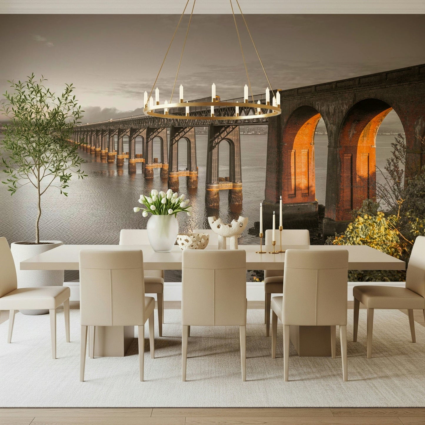 Tay Rail Bridge wallpaper mural behind a long dining table with cream chairs and ring chandelier