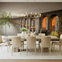 Tay Rail Bridge wallpaper mural behind a long dining table with cream chairs and ring chandelier