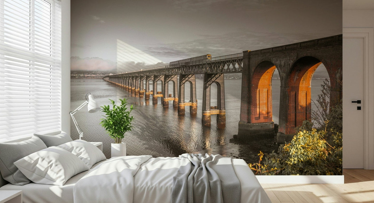 Tay Rail Bridge wallpaper mural with glowing arches over water behind a white bed in a bedroom