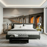 Tay Rail Bridge wallpaper mural behind a dark grey leather bed with white bedding in a bedroom
