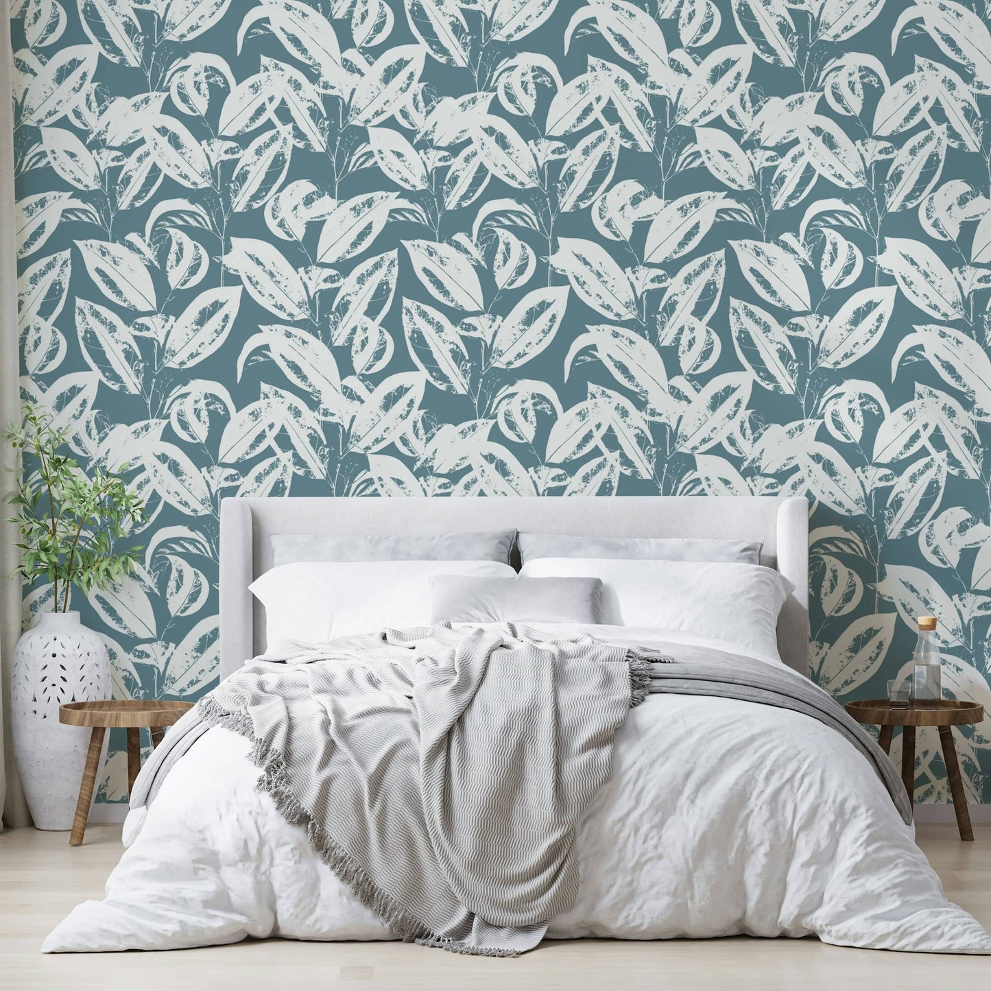 The image features stylized or abstract leaf shapes in various sizes.
