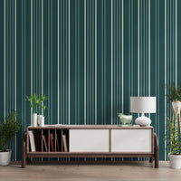 Teal Stripe wallpaper with cream pinstripes behind a dark wood media console flanked by green potted plants