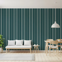 Teal Stripe wallpaper in teal and cream behind a wood bench and dining set under a white dome pendant light