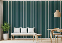 Teal Stripe wallpaper in cream and teal behind a wood bench with white cushions under a woven rattan pendant