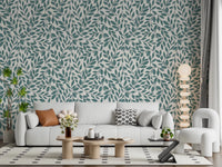 Teal Vines wallpaper of teal leaves on cream behind a white sofa and orb floor lamp in a modern living room