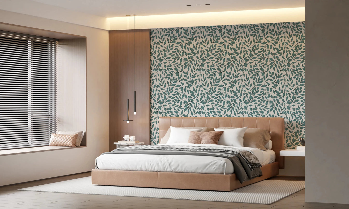 Teal Vines wallpaper of teal leaves behind a tan leather bed with white bedding and linear pendant lights