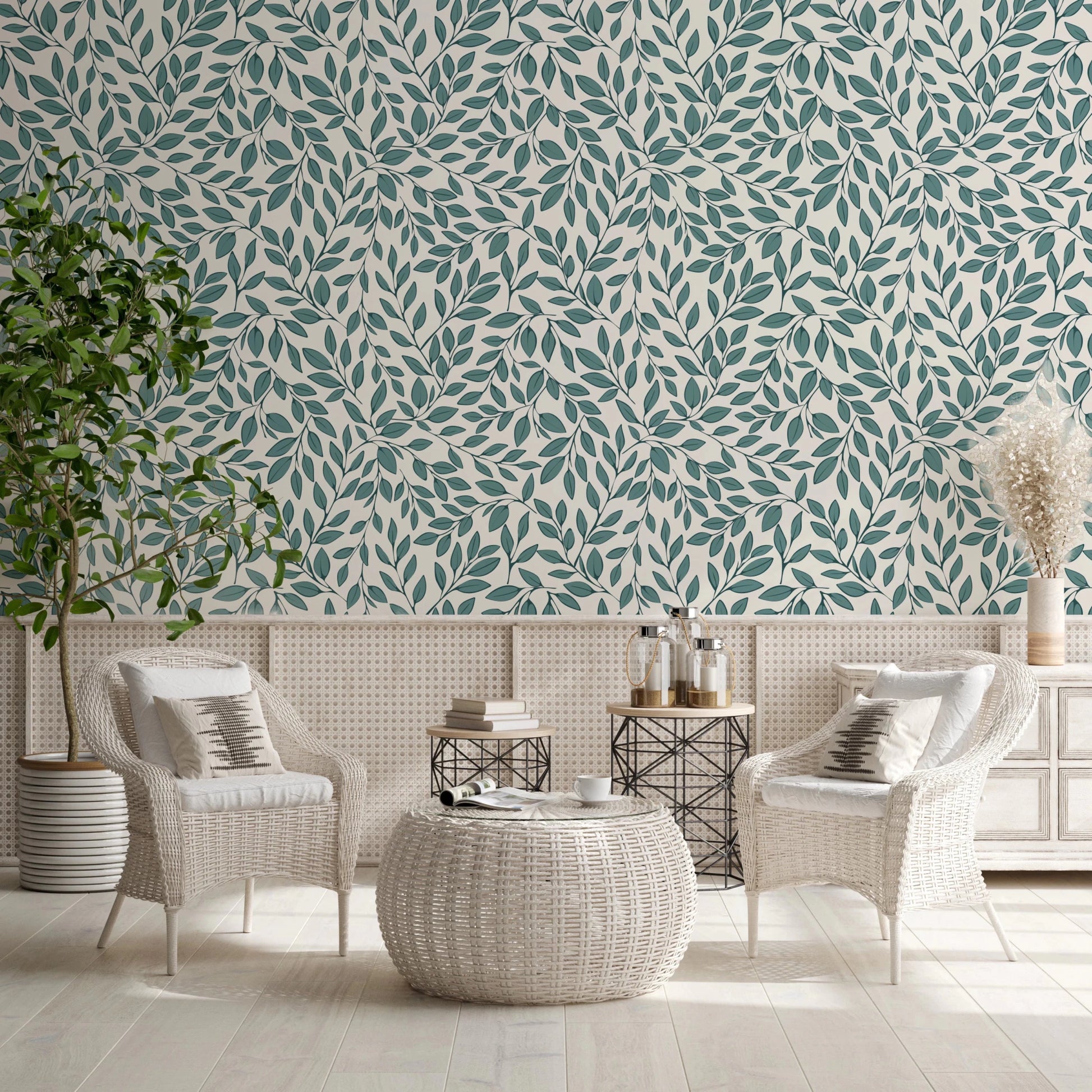Teal Vines wallpaper above cane wainscoting with white wicker chairs and a woven coffee table