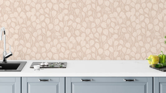 Terra-Toned Dewy Birch Branches wallpaper as a kitchen backsplash above blue-gray cabinets and a white counter