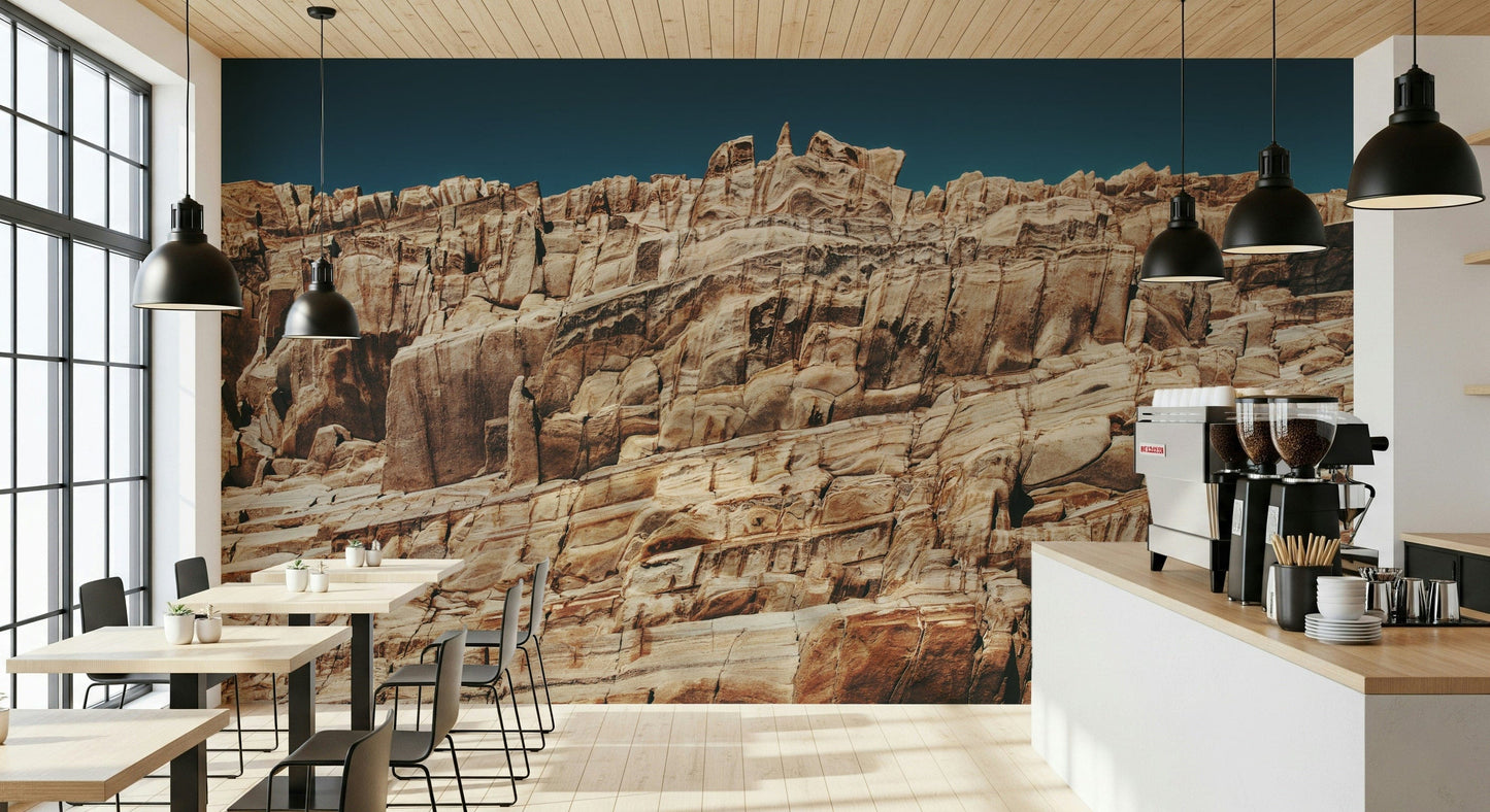 Textured wall mural with layered cliff formations in earthy red and orange hues for rustic and modern spaces.