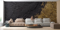 Intricate gold foil texture wallpaper with reflective light and dark tones.