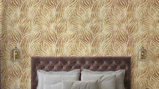 Textured Gold Zebra Print wallpaper in a bedroom with a mauve tufted headboard and glass pendant sconces
